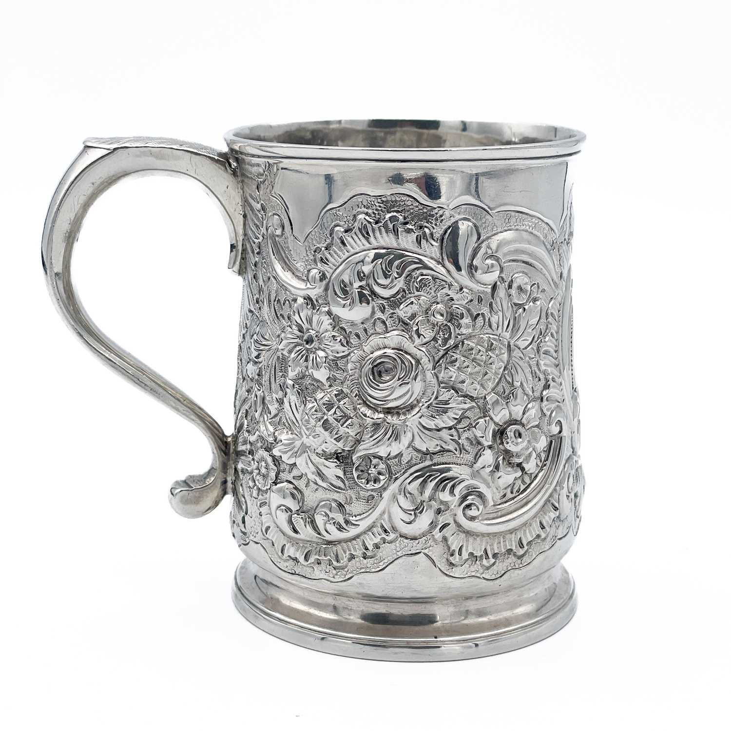 Lot 68 - An early George III silver embossed half pint