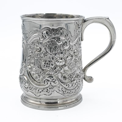 Lot 68 - An early George III silver embossed half pint mug by Thomas Whipham & Charles Wright.