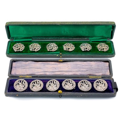 Lot 438 - Two cased sets of six silver buttons.