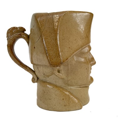 Lot 76 - A salt glaze stoneware Napoleon character jug.