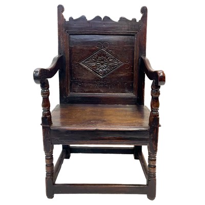 Lot 77 - A 17th century oak North Country Wainscot armchair.