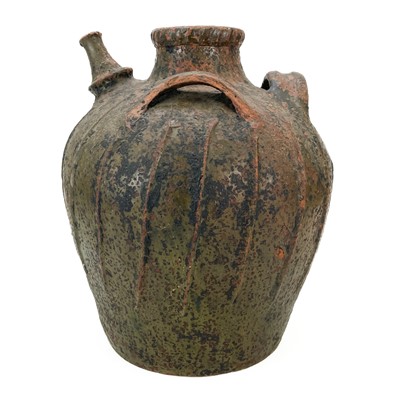 Lot 209 - A large French terracotta walnut jar.