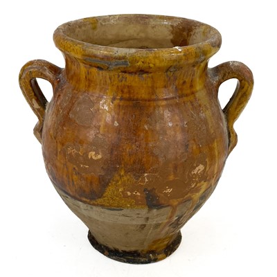 Lot 162 - A 19th century French pottery twin handled confit pot.