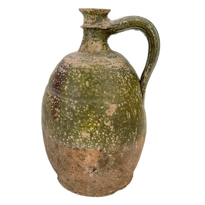 Lot 128 - An early 19th century large French pottery oil jug.