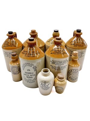 Lot 58 - A group of six stoneware ginger beer and other beverage flagons.