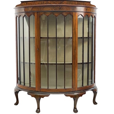 Lot 745 - An Art Deco walnut demi lune display cabinet.