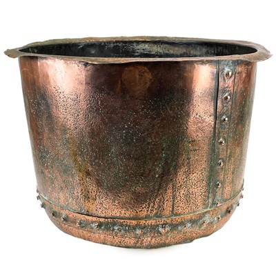 Lot 144 - A large late Victorian riveted copper cauldron.