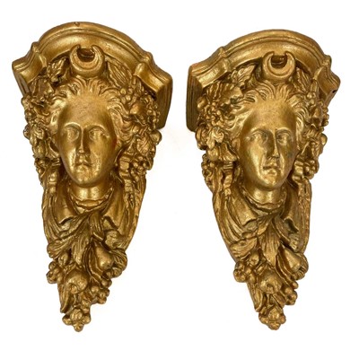 Lot 66 - A pair of gold painted plaster wall brackets.