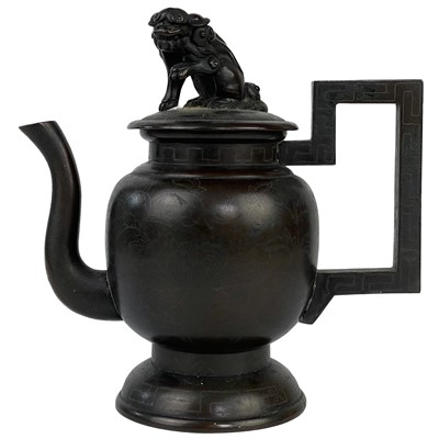 Lot 1245 - A Chinese bronze and silver inlaid teapot, 19th century.