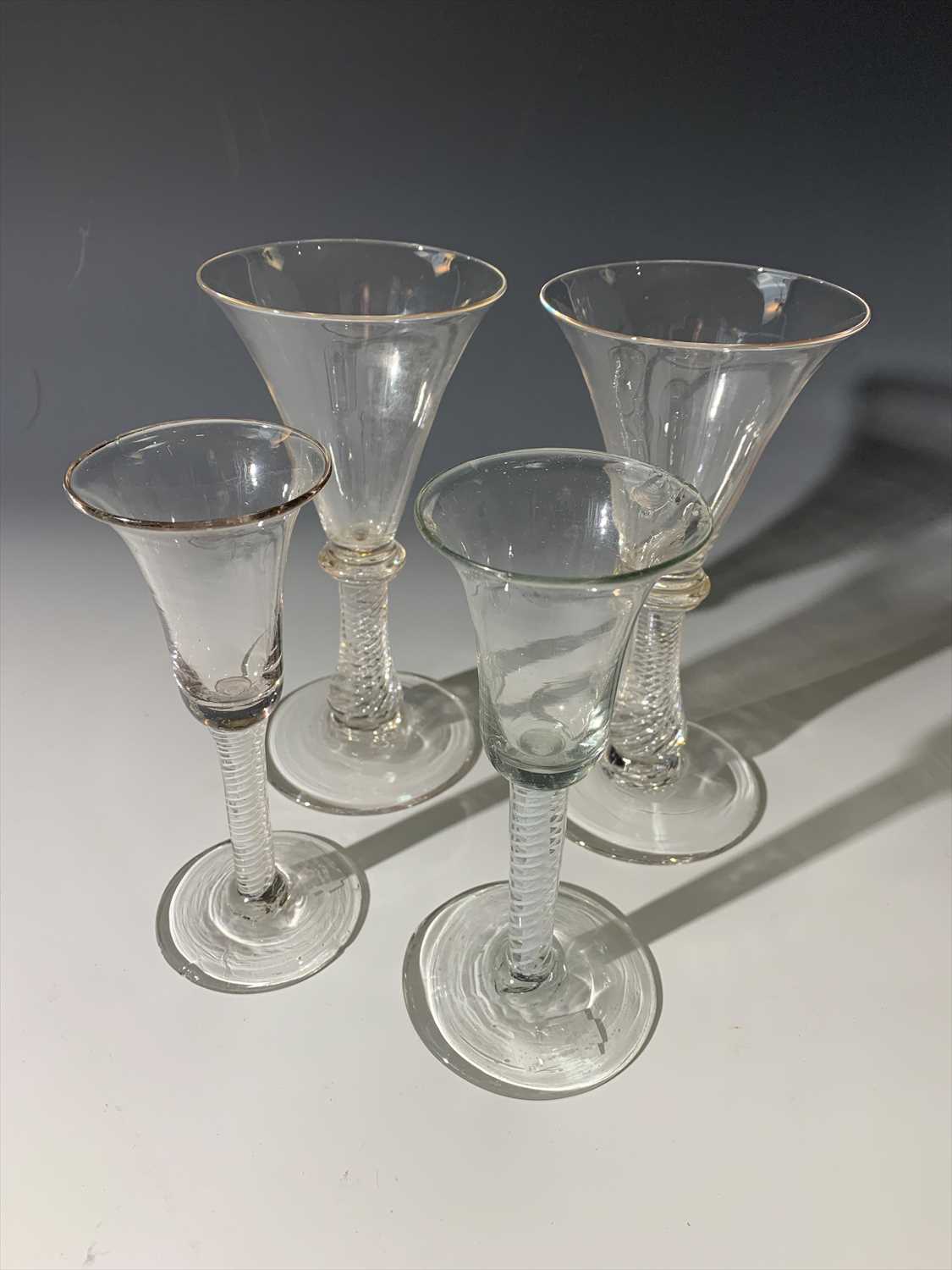 Lot 1481 - A pair of spiral stem glasses and two 18th...