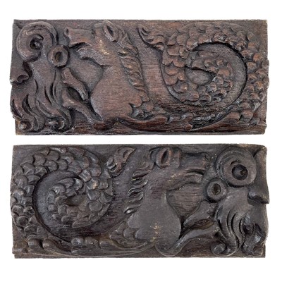 Lot 199 - A pair of oak carved panels.