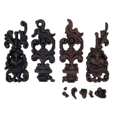 Lot 222 - Two carved oak finials or mounts.