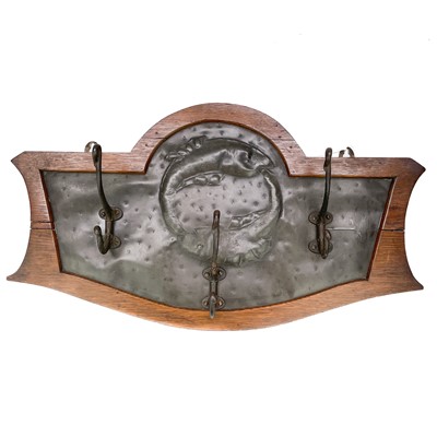 Lot 168 - An Arts and Crafts pewter and oak coat rack.