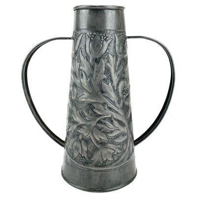 Lot 217 - An Arts and Crafts pewter twin handles vase.