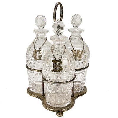 Lot 107 - A late Victorian three bottle silver plated decanter stand.