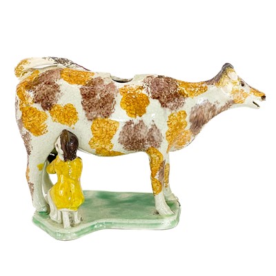 Lot 216 - A creamware cow creamer.